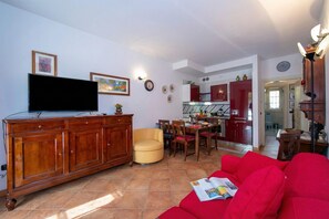 Family Apartment, 1 Bedroom, Terrace (Casa Emma with Pool) | Living area | 21-inch flat-screen TV with cable channels, TV - Casa Emma with Pool (Sirmione)