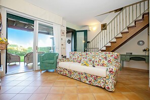 Family Townhome, 3 Bedrooms, 2 Bathrooms, Mountainside (Casa Prais With Pool) | Living area | 21-inch flat-screen TV with cable channels, TV, fireplace