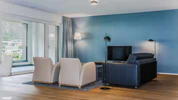 Apartment, 2 Bedrooms | Living area | Flat-screen TV, heated floors