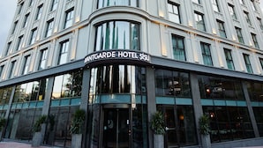 A multi-story hotel with a modern facade, large windows, and a prominent entrance. - Avantgarde Urban Şişli (Istanbul)