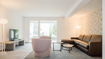 Apartment, 2 Bedrooms | Living area | Flat-screen TV, heated floors