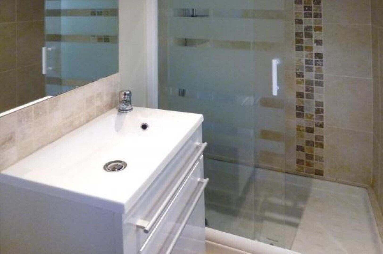 Shower, hair dryer, towels, toilet paper