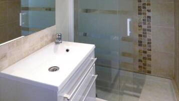 Shower, hair dryer, towels, toilet paper