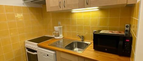 Fridge, microwave, oven, cookware/dishes/utensils