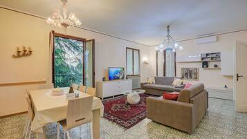 Family Villa, Multiple Bedrooms (Villa Alberti 900m from Garda lake) | Living area | 21-inch Smart TV with cable channels