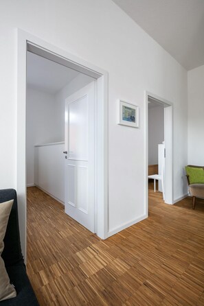 Appartement familial (Kontor West) | Aire de séjour | Planchers chauffants