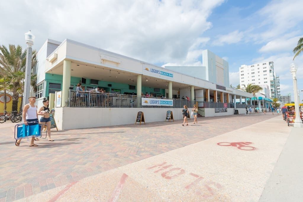 A beach bar with outdoor seating and a bike lane.