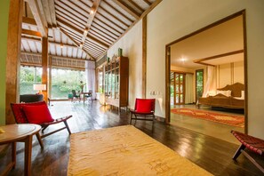 A spacious room with a wooden ceiling, a large window, a bed, and a dining area. - Beautiful Villa with Private Pool, Bali Villa 2049 (Bali)