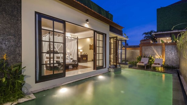 A modern villa with a private pool, a bedroom with a canopy bed, and a lounge area with chairs. - 5 Star Villa for Rent in Bali, Bali Villa 2078 (Bali)