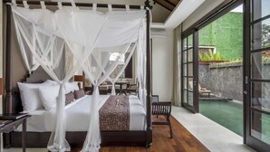 A four-poster bed with white linens and a canopy, a wooden floor, and a view of a swimming pool through large glass doors. - 5 Star Villa for Rent in Bali, Bali Villa 2078 (Bali)