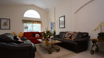 House (4726 4-Bedroom Pool Home,Cumbrian La) | Living room | Flat-screen TV, DVD player, table tennis