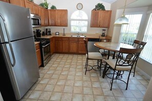 House (2509LJT 4-Bedroom Pool Home near Disn) | Private kitchen | Fridge, microwave, oven, stovetop