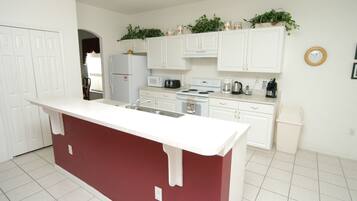 House (4636 5-Bed Disney Area Pool Home, Cum) | Private kitchen | Fridge, microwave, oven, stovetop