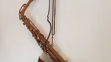 A saxophone mounted on a wall.