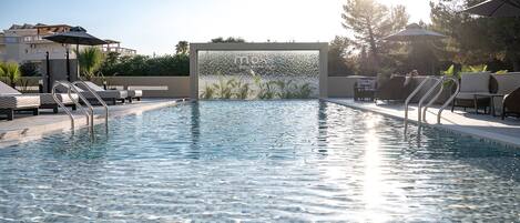 Outdoor pool, pool umbrellas, sun loungers