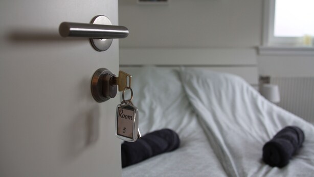 A hotel room door with a keycard lock and a key. - Nordic Inn Thorshavn (Tórshavn)