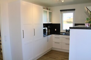 Fridge, microwave, cookware/dishes/utensils