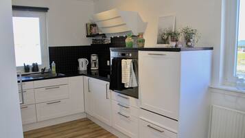 Fridge, microwave, cookware/dishes/utensils