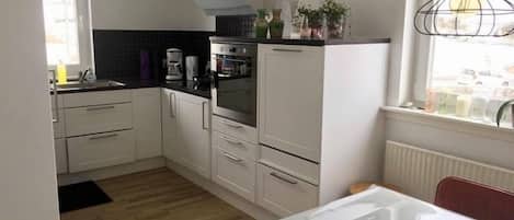 Fridge, microwave, cookware/dishes/utensils