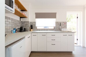 Fridge, microwave, stovetop, coffee/tea maker