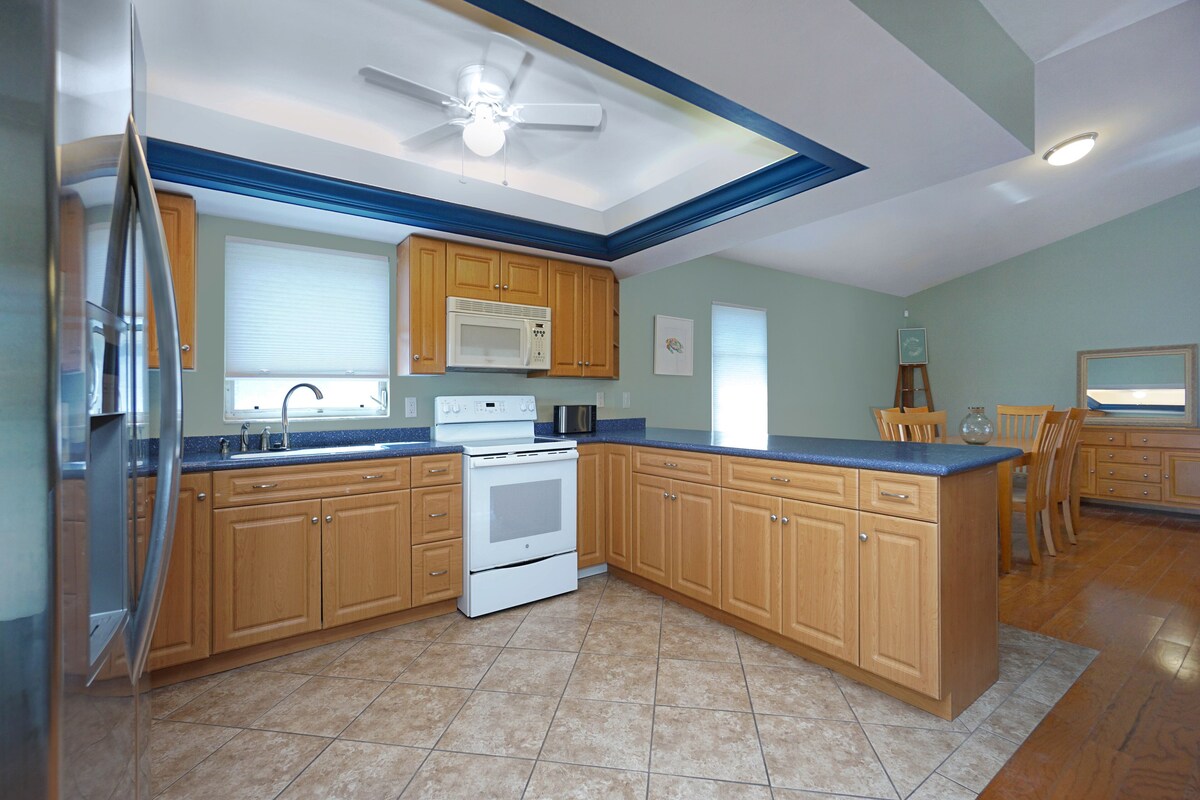 Photo 13 of Amazing 4 Bedroom 3 Bath Pool Home. About 1 mile from the Beach and Great Eats