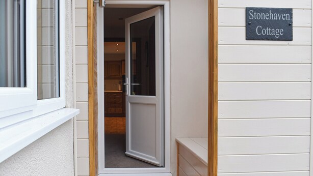 A cottage entrance with a sliding glass door leading to a kitchen area. - 2 bedroom accommodation in Nosterfield, near Masham (Nosterfield, near Masham)