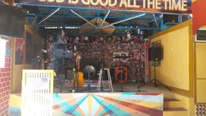 A stage with a banner reading "GOD IS GOOD ALL THE TIME" and musical instruments. - Ferrer's Villa Apt 2 close to beaches, parks, banks, market and parks. (Romblon Odiongan)