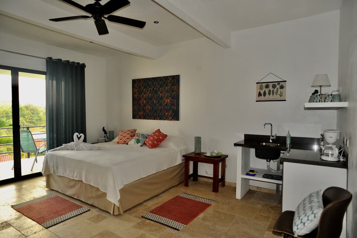 Premium bedding, laptop workspace, blackout curtains, iron/ironing board