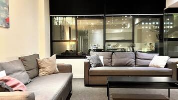 City Apartment | Living area | 40-inch flat-screen TV with digital channels, TV, Netflix