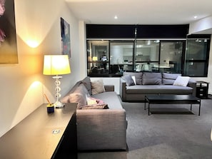 City Apartment | Living area | 40-inch flat-screen TV with digital channels, TV, Netflix