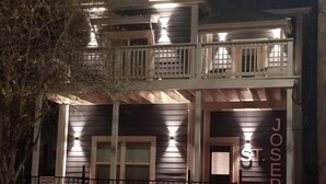 A two-story building with a balcony and a sign that reads "JOSEPH".