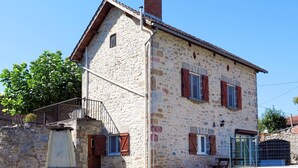 A stone building with a tiled roof, a small staircase, and a metal gate. - Stunning private villa for 5 guests with private pool, A/C, TV, terrace and panoramic view (La Grèze)