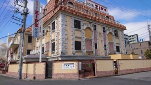 A hotel with a sign reading "HOTEL ZIPS" and a sign indicating a hotel lobby entrance. - Hotel Zips - Adults Only (Kawaguchi)