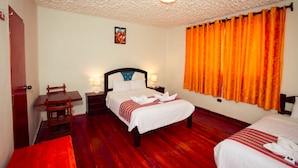 A hotel room with a wooden floor, a bed with white bedding, a nightstand with a lamp, and a wooden chair. -  HOTEL MOSOQ KILLA (Cusco)