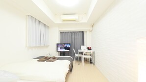 Appartement (One-Bedroom) | 1 slaapkamer, verduisterende gordijnen, een strijkplank/strijkijzer