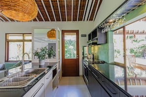 Fridge, microwave, stovetop, dining tables