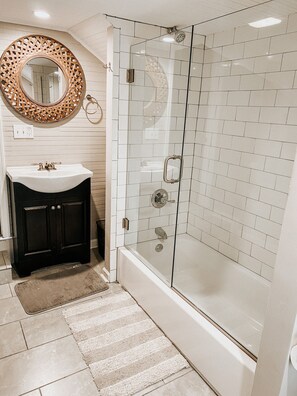 Combined shower/tub, hair dryer, towels, soap