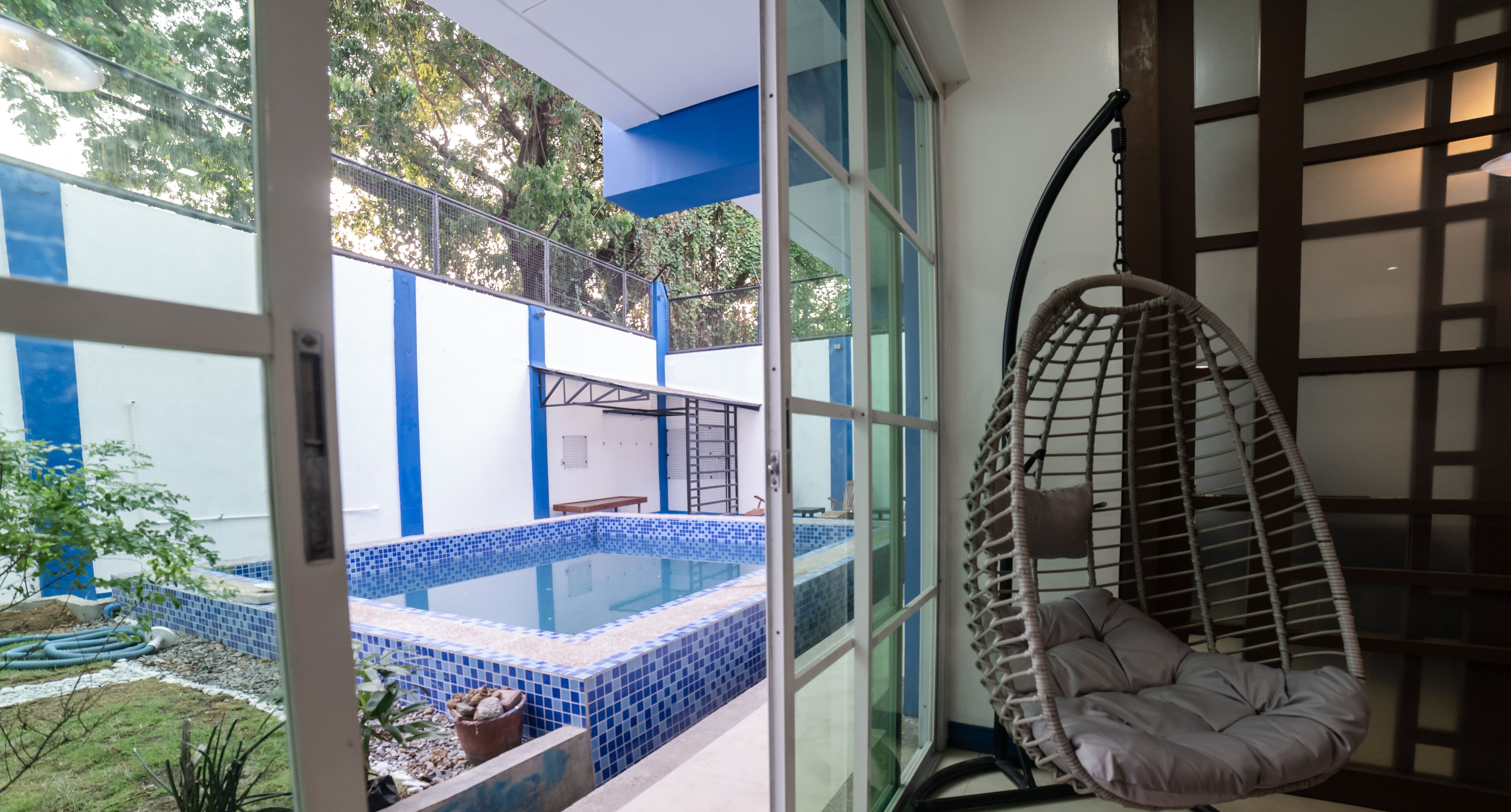 Outdoor pool, open 6:00 AM to 10:00 PM, pool loungers