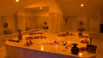 Bathroom features a large mirror and a bathtub, with ample space for toiletries and a towel.