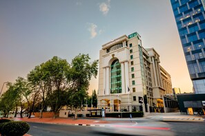 A multi-story hotel with a prominent 'Southern Sun' sign, large windows, and a classic architectural style. - Southern Sun Sandton (Johannesburg)