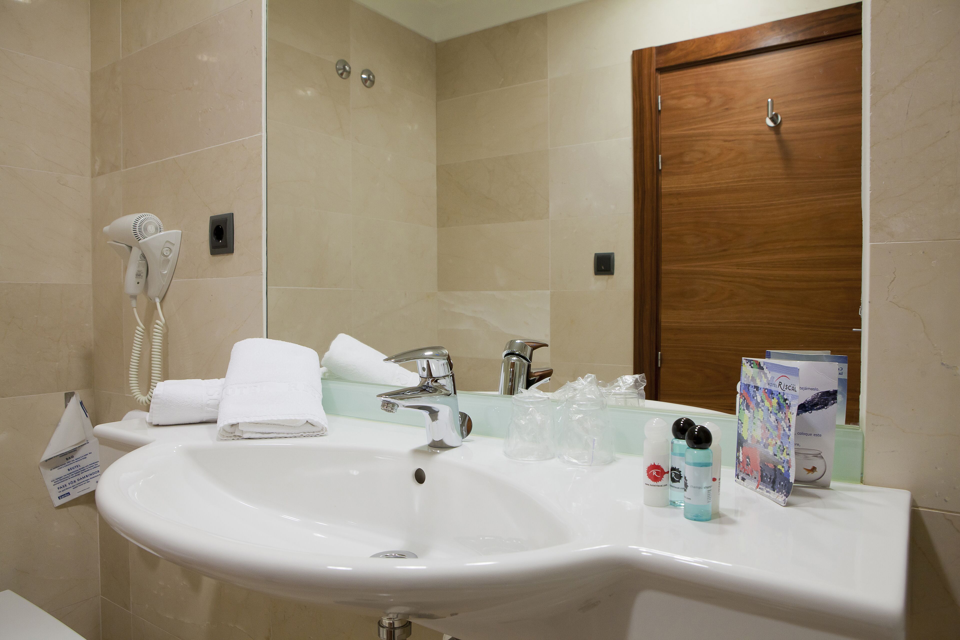 bathtub, hair dryer, bidet, towels