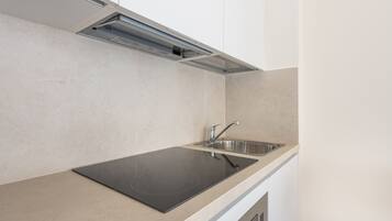 Fridge, microwave, stovetop, cookware/dishes/utensils