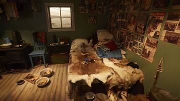 A room with a bed covered in fur, a wooden floor, and various items scattered around.