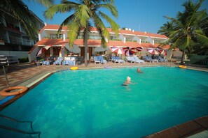 Outdoor pool, open 11:00 AM to 6:00 PM, pool umbrellas, sun loungers