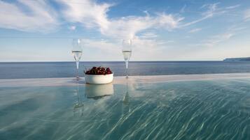 Seasonal outdoor pool, pool umbrellas, pool loungers