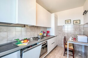 Family Apartment, 2 Bedrooms (Bardolino Garden Pool &Tennis on the) | Private kitchen | Full-sized fridge, microwave, oven, stovetop