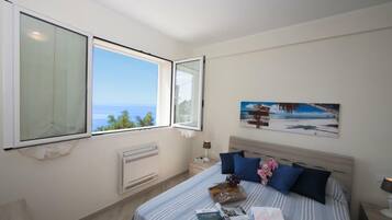 Family Apartment, Multiple Bedrooms, 2 Bathrooms, Mountainside (Serena 1 Amazing Sea View) | 2 bedrooms, iron/ironing board, WiFi, bed sheets