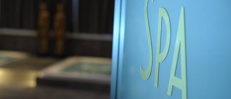 A blue wall with the letters "SPA" in a light color.