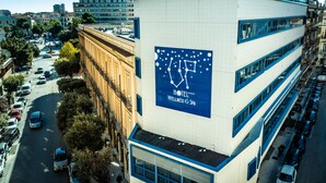 A hotel building with a large sign advertising a wellness and spa center. - Hotel Up Museum - Wellness & Spa (Foggia)