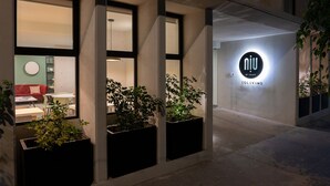 A modern building with large windows and potted plants. - NIU Modern & Centric Lofts (Mexico City)